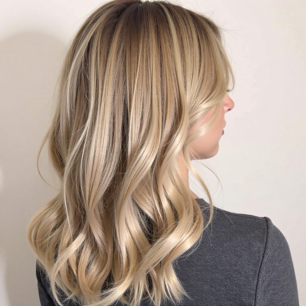 Hairstyle With a Loose Braid Sprayed With Glitter Spray
